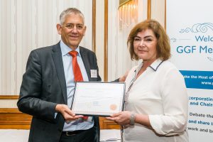 GGF CEO Kevin Buckley presents Abigail Chapman of Slimline Glazing with GLASS Charter Bronze Level Certificate