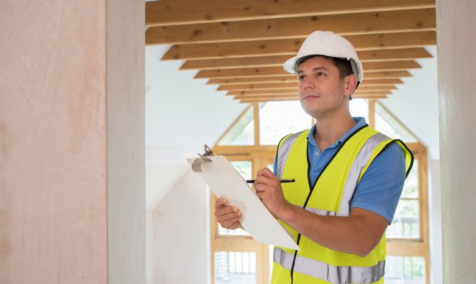 Building Inspector Looking At New Property