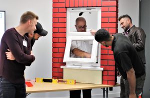 GGF Installer Training Course attendees examine a window installation
